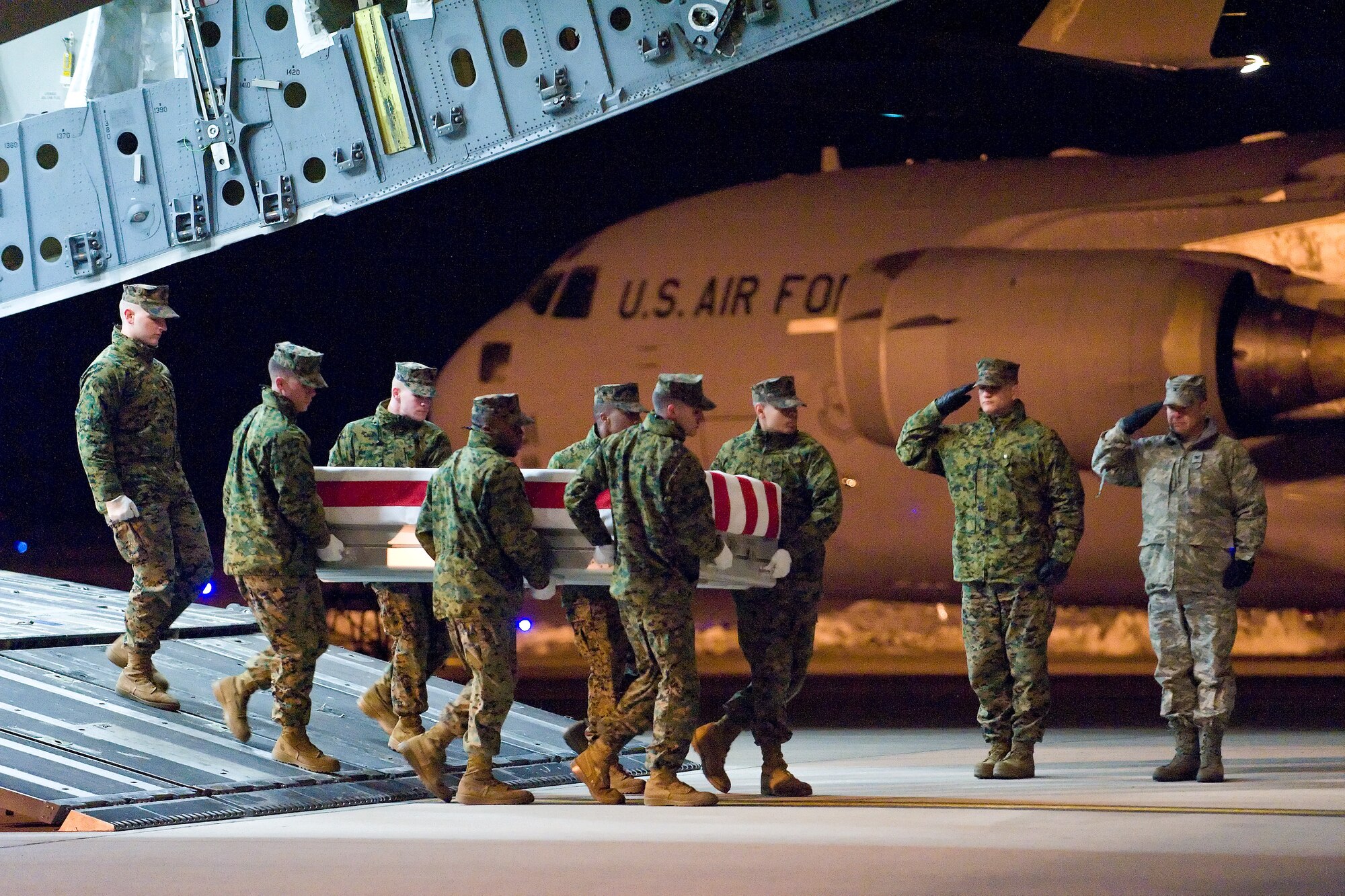 A U.S. Marine Corps team transfers the remains of Marine Corps Lance Cpl. Alejandro J. Yazzie, of Rock Point, Ariz., at Dover Air Force Base, Del., February 18. (U.S. Air Force photo/Roland Balik)