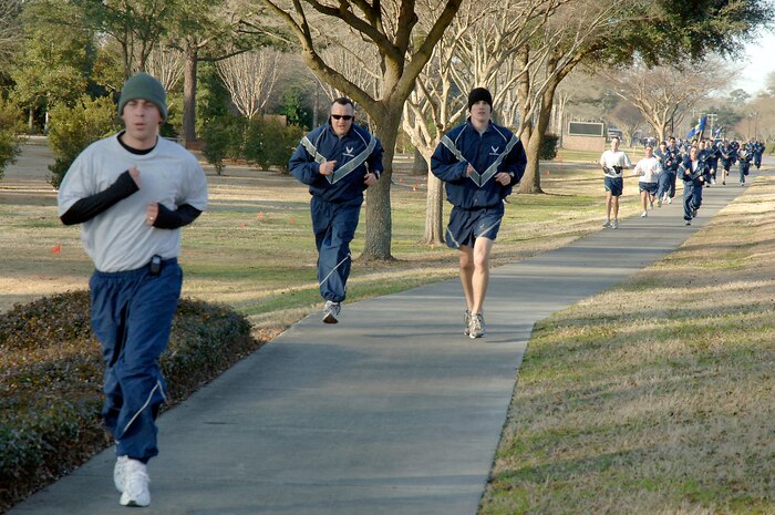 Joint Team Charleston members stride to the finish of the monthly commander's fitness challenge Feb. 19, 2010, at Joint Base Charleston, S.C. This month's fitness challenge kicked off Military Saves Week which runs Feb. 21 through 28 and persuades, motivates, and encourages military families to save money every month. More than 350 Airmen participated in this month's fitness challenge.(U.S. Air Force photo/Staff Sgt. Marie Brown)