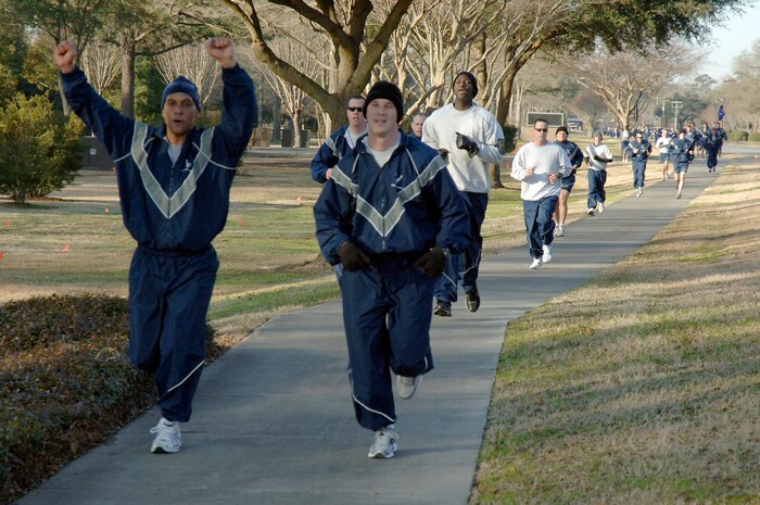 Col. Brian Robinson, left, and Capt. Garrett Fisher, right, make a strong finish at the end of the monthly commander's fitness challenge Feb. 19, 2010, at Joint Base Charleston, S.C. More than 350 Airmen participated in this month's fitness challenge. Colonel Robinson is the 437th Airlift Wing vice commander and Captain Fisher is a 437 AW executive officer. (U.S. Air Force photo/Staff Sgt. Marie Brown)
