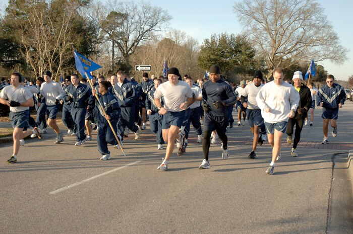 Members of Joint Base Charleston take off from the starting line at the beginning of the monthly commander's fitness challenge Feb. 19, 2010, at Joint Base Charleston, S.C. This month's fitness challenge kicked off Military Saves Week which runs from Feb. 21 through 28 to persuade, motivate, and encourage military families to save money every month. (U.S. Air Force photo/Staff Sgt. Marie Brown)