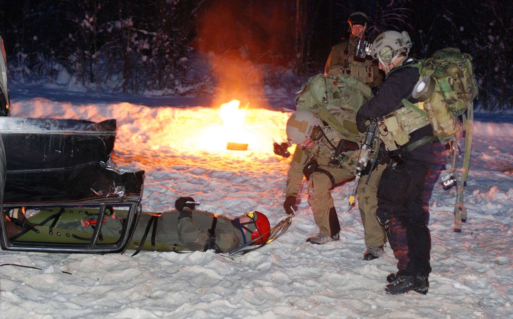 ANCHORAGE, Alaska - Air Force Reserve Pararescuemen from the 920th Rescue Wing train in cold-weather environments to simulate their up-coming deployment weather. The PJs must be able to extract a victim from a vehicle/piece of equipment while working under combat situations. (U.S. Air Force photo/Staff Sgt. Leslie Kraushaar)