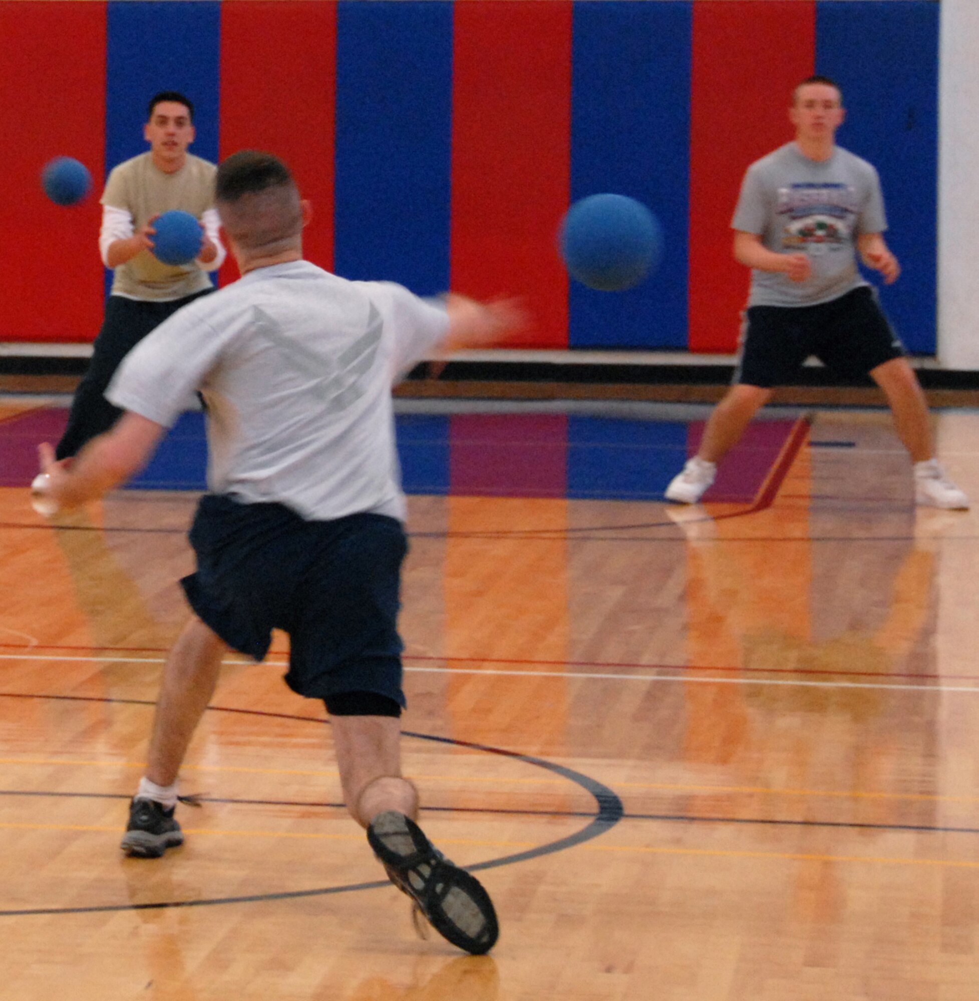 EGLIN AIR FORCE BASE, Fla. –  A “Clamhammer” member fires a shot at the “Cops” team during a dodge ball tournament at the Eglin Fitness Center, Feb. 19. Nine five-member teams competed to become the dodge ball champs in double-elimination rounds. The Cops team came out victorious beating the “Family First” team twice in the championship match. (U.S. Air Force photo/ Airman 1st Class Anthony Jennings)