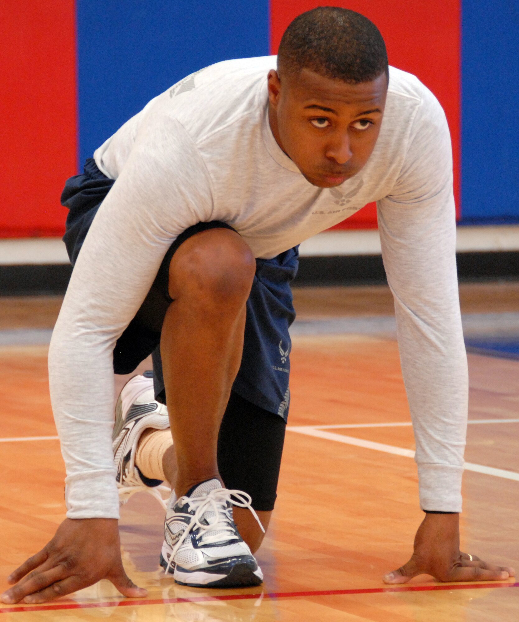 EGLIN AIR FORCE BASE, Fla. –  A player from the “Family First” team readies to sprint for the center boundary line during a dodge ball tournament at the Eglin Fitness Center, Feb. 19. Nine five-member teams competed to become the dodge ball champs in double-elimination rounds. The “Cops” team came out victorious after beating the “Family First” team twice in the championship match. (U.S. Air Force photo/ Airman 1st Class Anthony Jennings)