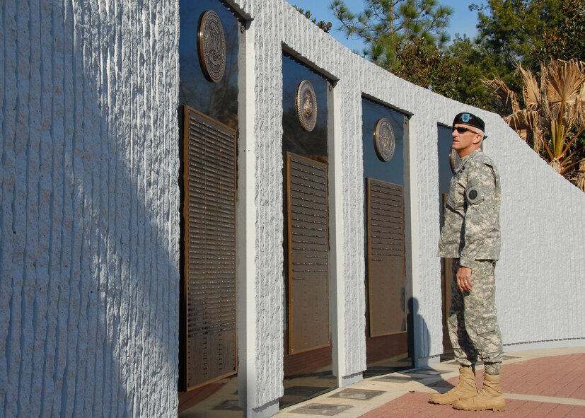 Lt. Gen. Mark Hertling, U.S. Army Training and Doctrine Command, solemnly observes the Explosive Ordnance Disposal Memorial Feb. 17 at the Navy EOD School located on the Eglin Air Force Base range.   The general, in charge of initial military training for the U.S. Army, visited the school to get a first-hand look at EOD training.  Soldiers account for 60 percent of the school’s attendance.  (U.S. Air Force photo/Samuel King Jr.)