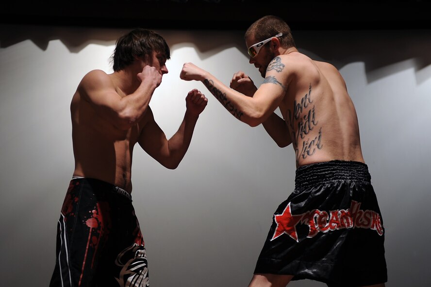 Carl Stevenson and William Bratz, mixed martial arts fighters, square-off after weigh-ins at the base theater on Seymour Johnson Air Force Base, N.C., Feb. 18, 2010. Stevenson and Bratz will compete in an on-base cagefight in the welterweight division Feb. 19, 2010. To compete in the welterweight division, the fighters must weigh in between 156 and 170 pounds. (U.S. Air Force photo/Senior Airman Ciara Wymbs) 