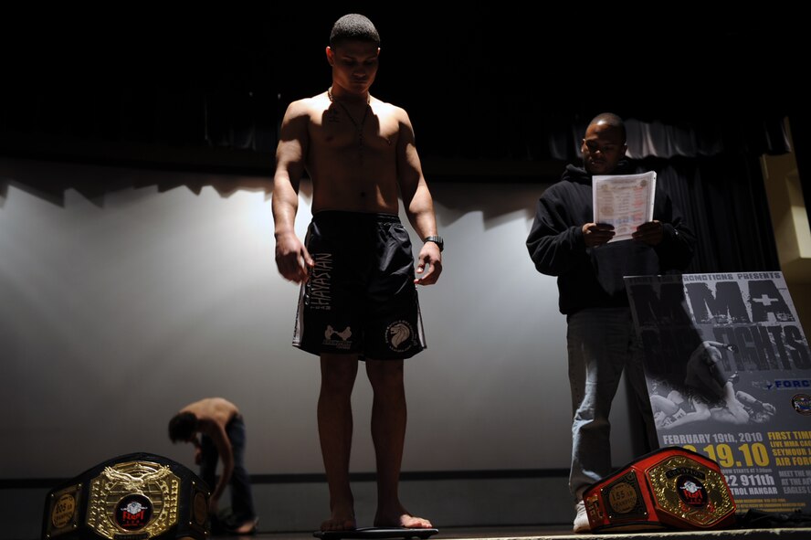 Bobby Sellers, mixed martial arts fighter, weighs-in at the base theater on Seymour Johnson Air Force Base, N.C., Feb. 18, 2010. Before being able to compete professionally, fighters must win five bouts. A bout is a contest or trial of strength. (U.S. Air Force photo/Senior Airman Ciara Wymbs) 
