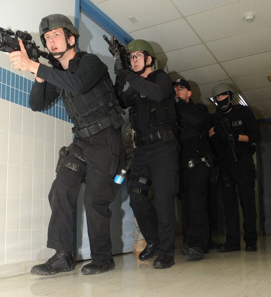 BARKSDALE AIR FORCE BASE, La. – Members of the Barksdale’s Emergency Services Team swiftly moves into position to clear a room during a training session at an off-base location Feb. 18. Barksdale’s EST is one of the only teams left in the military as most bases use civilian departments.  (U.S. Air Force photo by Senior Airman Alexandra Longfellow) (RELEASED)