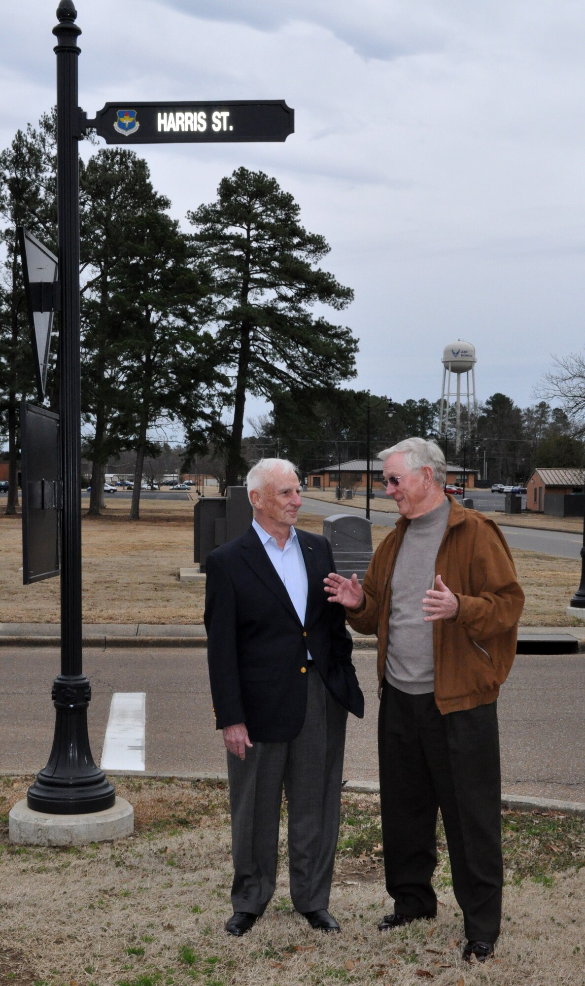 Retired Col. Carlisle “Smitty” Harris talks with retired Lt. Col. Richard “Gene” Smith at the street named in honor of Colonel Harris in 2007 on Thursday Feb. 11.  Colonel Harris, now residing in Tupelo, Miss.,  was a POW in Vietnam for nearly eight years  and is credited for improvising the “Tap Code” while held in captivity. Lt Col Smith, residing in West Point, Miss., was a POW in Vietnam for five and a half years and the wing ceremonial plaza is named in his honor.  Feb 12 marked the 37th anniversary of Colonel Harris’ repatriation.  Both former POW’s visited Columbus AFB to participate in the Maj/Lt Col promotion party at the Columbus Club. (U.S. Air Force photo/SrA Jacob Corbin)
