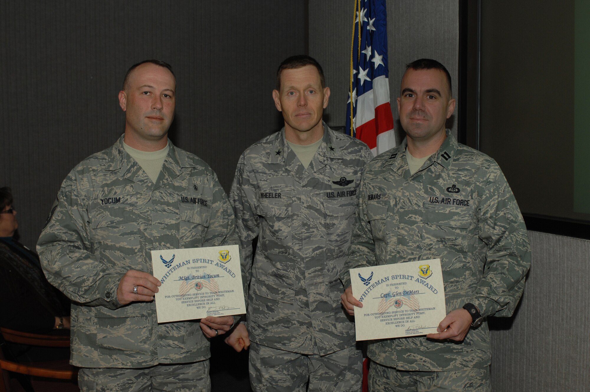 WHITEMAN AIR FORCE BASE, Mo. - Brig. Gen. Robert Wheeler, 509th Bomb Wing commander, presented Capt. Glen DeMars, 509th Operations Support Squadron, and Master Sgt. Britian Yocum, 509th Medical Support Squadron, with the Whiteman Spirit Award Feb. 17, 2010. (U.S. Air Force photo/Staff Sgt. Lauren Padden)