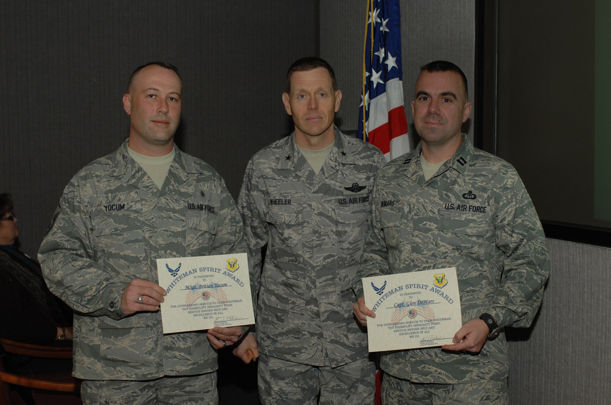 WHITEMAN AIR FORCE BASE, Mo. - Brig. Gen. Robert Wheeler, 509th Bomb Wing commander, presented Capt. Glen DeMars, 509th Operations Support Squadron, and Master Sgt. Britian Yocum, 509th Medical Support Squadron, with the Whiteman Spirit Award Feb. 17, 2010. (U.S. Air Force photo/Staff Sgt. Lauren Padden)