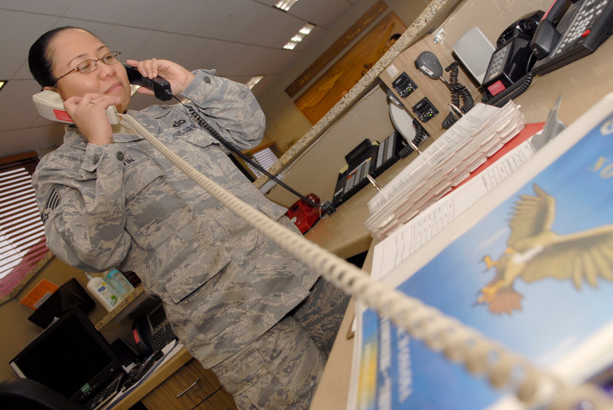 VANDENBERG AIR FORCE BASE, Calif. -- Simulating operations during an aircraft emergency, Staff Sgt. Lilanae Martin, 30th OSS NCO in charge of airfield operations, communicates to emergency responders here Thursday, Feb. 18, 2010.  A 1966 Cessna Skyway airplane had to make an emergency landing on the flightline here Wednesday, Feb. 17, 2010, due to the damaged engine block.  (U.S. Air Force photo/Senior Airman Andrew Satran) 

 


 
 