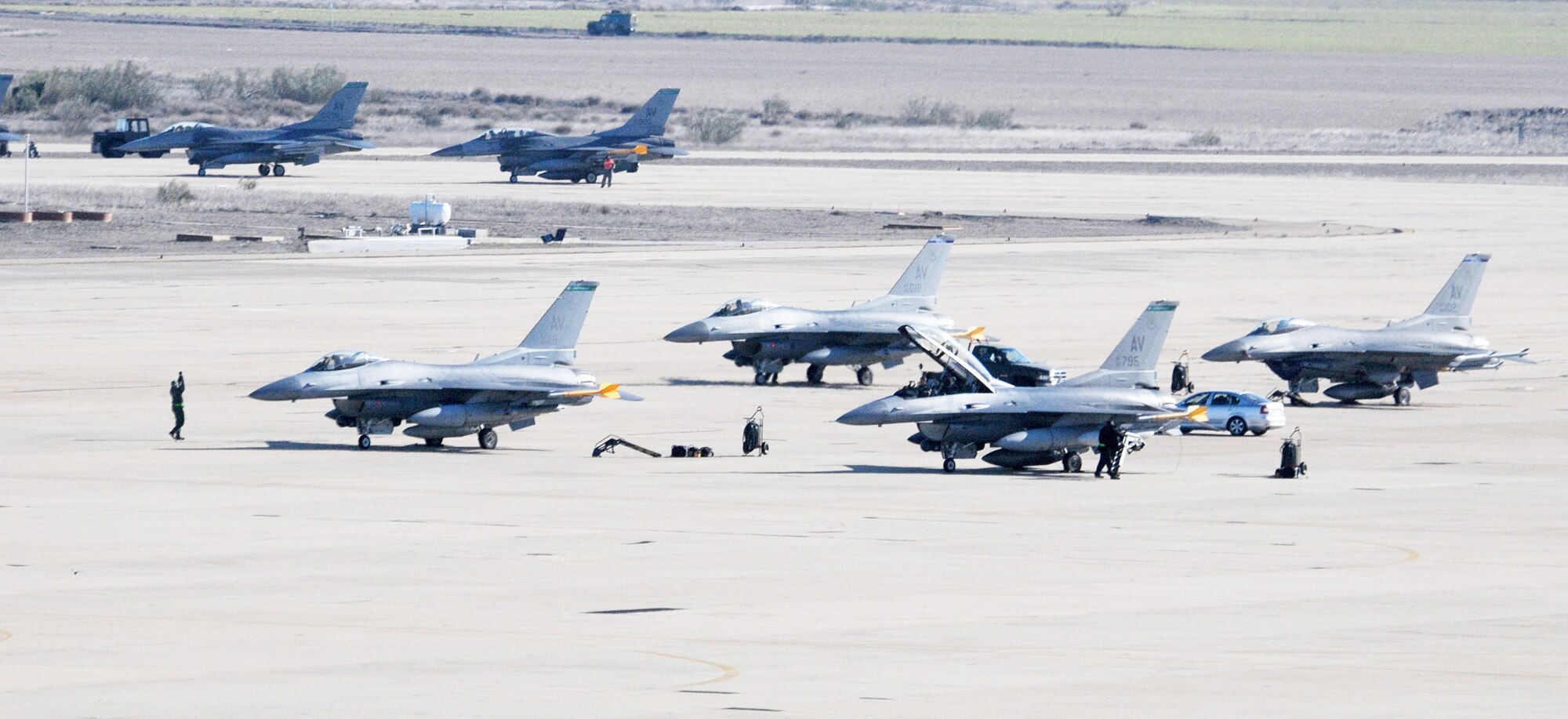 Airmen from the 555th Aircraft Maintenance Unit prepare jets for takeoff Feb. 1, 2010, at Zaragoza Air Base, Spain. The 555th AMU Airmen deployed to Spain to support training operations for the 555th Fighter Squadron pilots. (U.S. Air Force photo/Senior Airman Tabitha M. Mans)