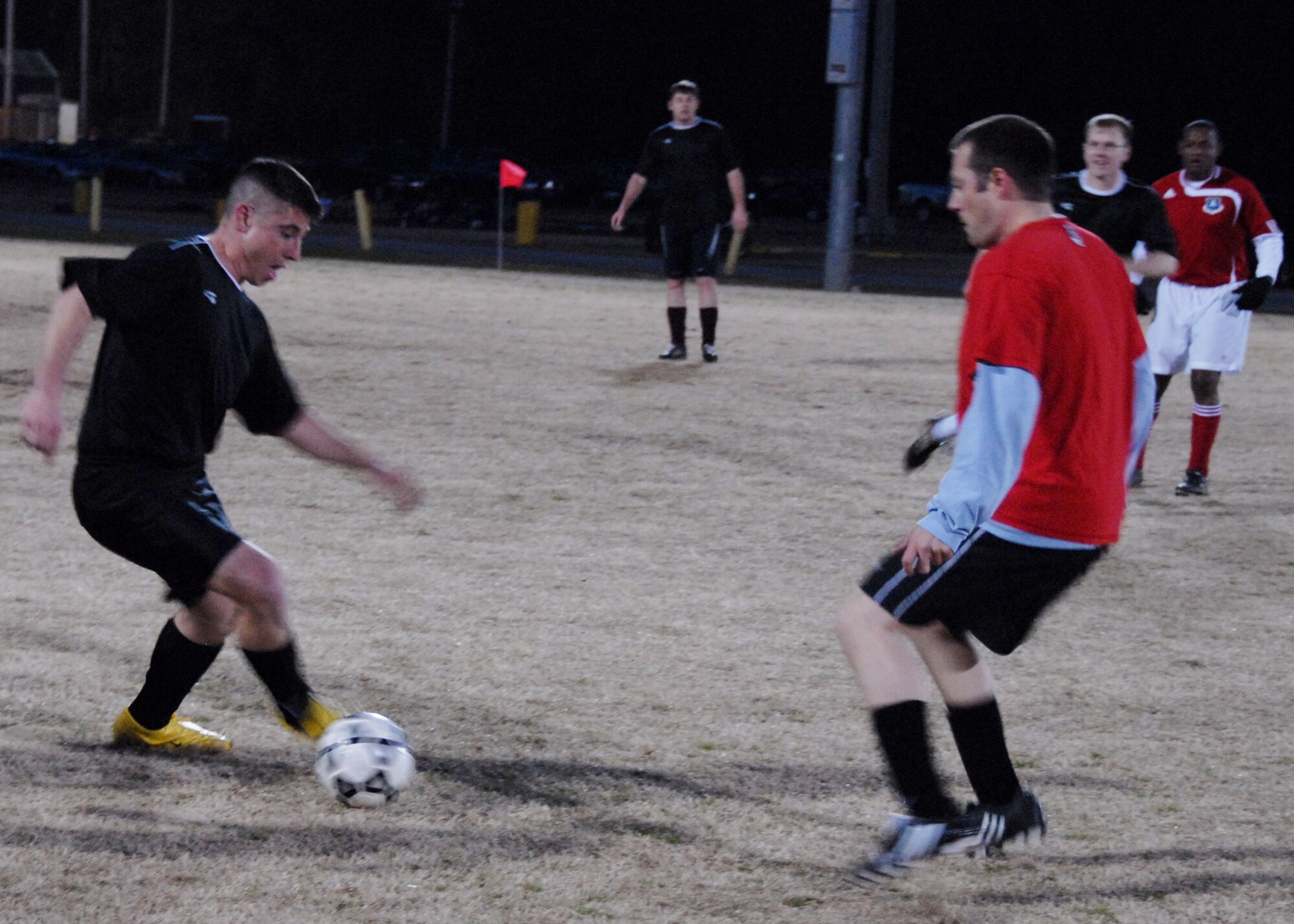 EGLIN AIR FORCE BASE, Fla. – Air Force Research Laboratory team member, Christopher Hergenreter, kicks the ball past a 96th Medical Group opponent during a hard-fought third game of the intramural soccer season, Feb. 17. AFRL came out victorious in the matchup, winning 1-0. Games are played Monday through Thursday, at 5:30 and 7:00 p.m. (U.S. Air Force photo/ Airman 1st Class Anthony Jennings)