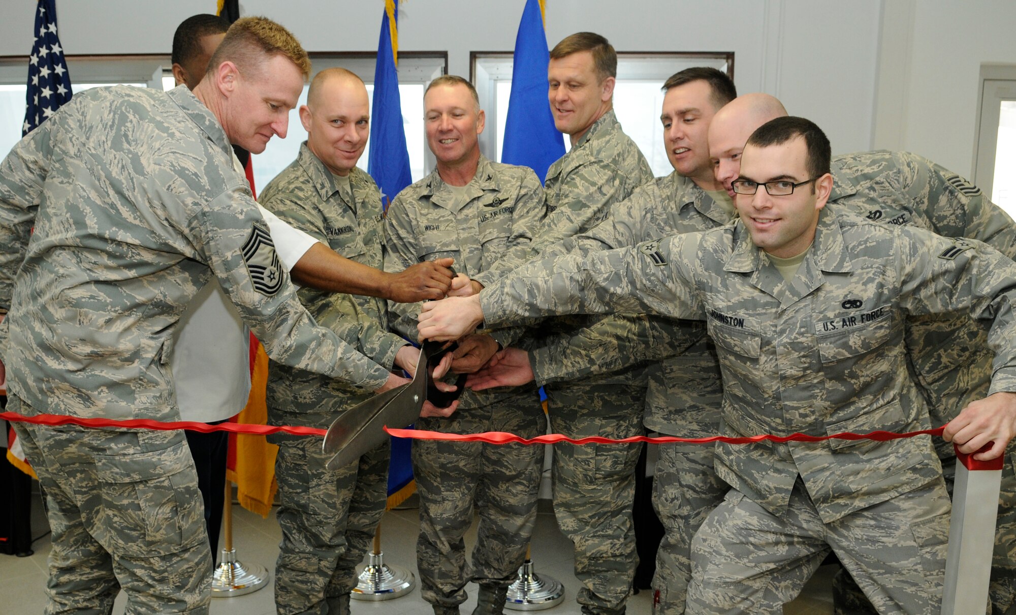 SPANGDAHLEM AIR BASE, Germany – Lt. Gen. Frank Gorenc, 3rd Air Force commander; Colonel Tip Wight, 52nd Fighter Wing and Chief Master Sgt. Dennis Vannorsdall are among the Airmen who cut the ribbon for the “Jet Blast” on the flightline Feb. 19. The “Jet Blast” is a facility that will give Airmen on the flightline an opportunity to use wireless Internet, get a haircut, visit a chaplain or eat a hot meal. (U.S. Air Force photo/Senior Airman Benjamin Wilson)