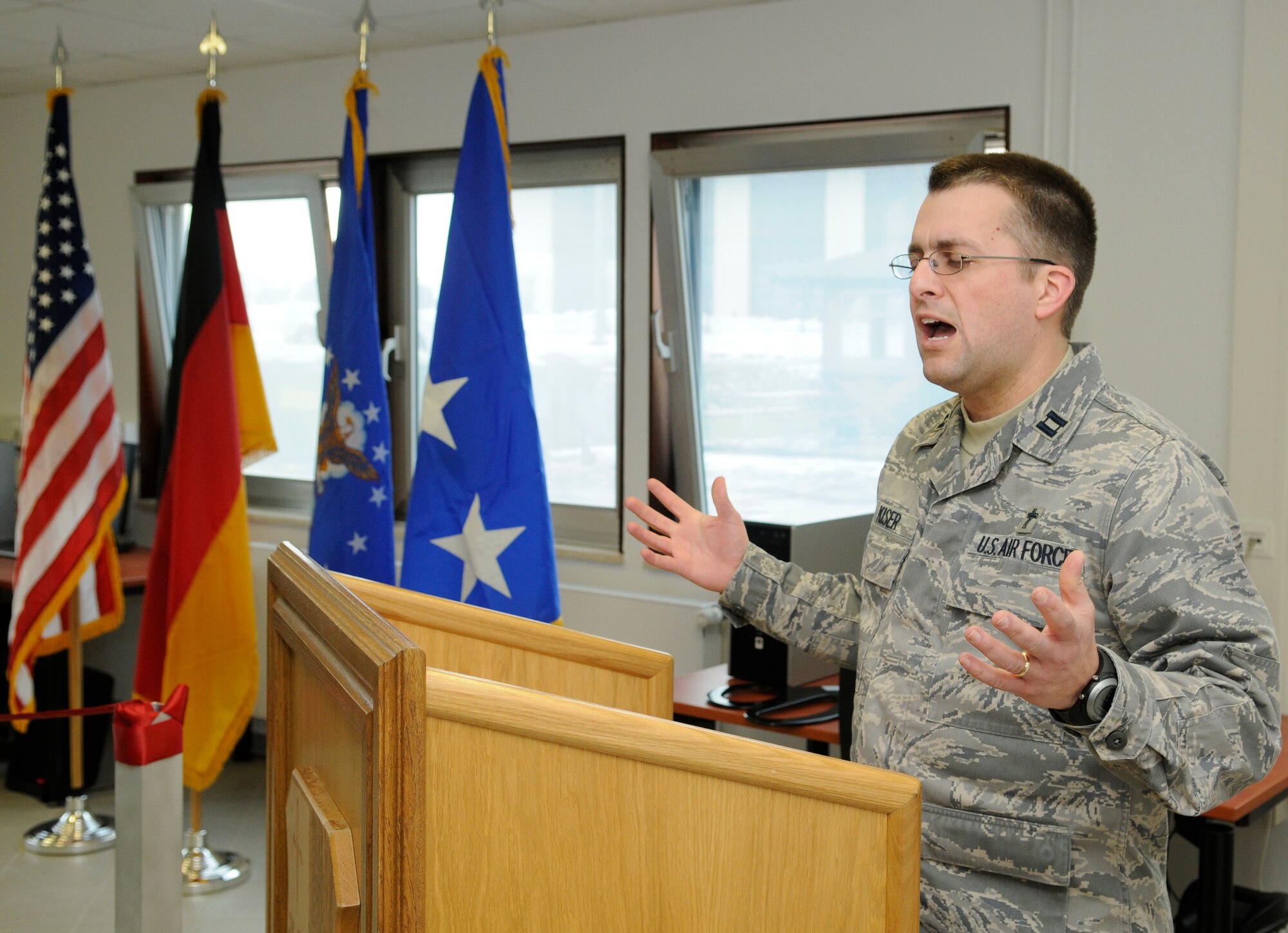 SPANGDAHLEM AIR BASE, Germany – Chaplain (Capt.) Ronald Kiser, 52nd Fighter Wing chapel, gives the invocation at the opening ceremony for the new “Jet Blast” on the flightline Feb. 18. The “Jet Blast” is a facility that will give Airmen on the flightline an opportunity to use wireless Internet, get a haircut, visit a chaplain or eat a hot meal. (U.S. Air Force photo/Senior Airman Benjamin Wilson)
