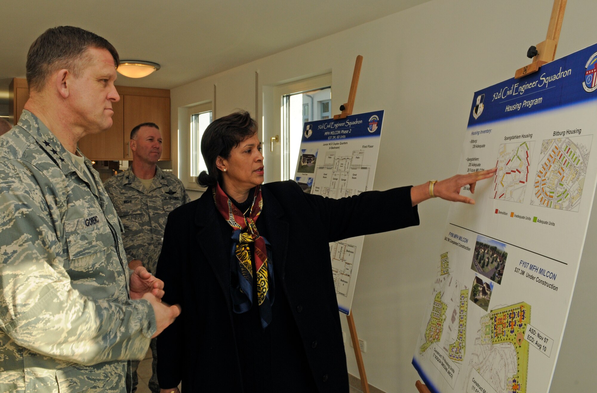 SPANGDAHLEM AIR BASE, Germany – Denise Hastye, 52nd Civil Engineer Squadron, shows Lt. Gen. Frank Gorenc, 3rd Air Force commander, the plan for relocating Spangdahlem Air Base members from Bitburg Annex to new Spangdahlem housing during his visit here Feb. 18. General Gorenc toured one of the new junior NCO houses, which are two story duplexes containing four bedrooms, one-and-a-half baths and a full sized garage. (U.S. Air Force photo/Senior Airman Benjamin Wilson)