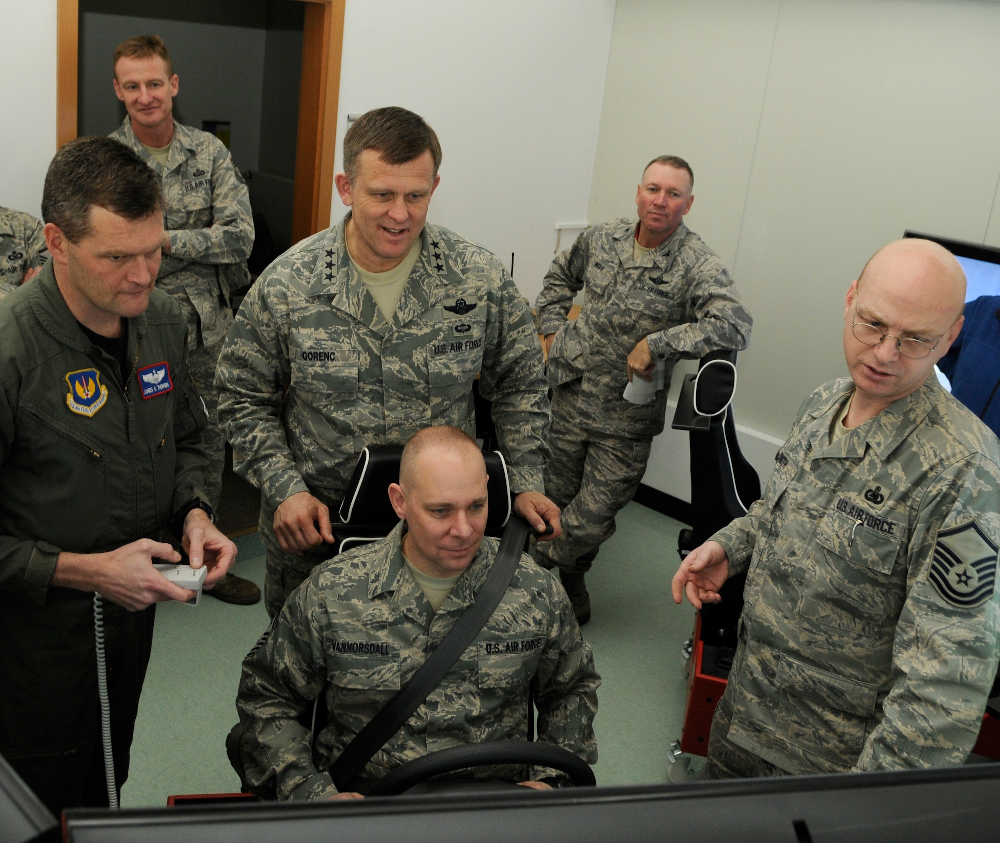 SPANGDAHLEM AIR BASE, Germany – Chief Master Sgt. Dennis Vannorsdall, 3rd Air Force command chief, uses Spangdahlem Air Base’s driving simulator while Lt. Gen. Frank Gorenc, 3rd Air Force commander, looks on Feb. 18. General Gorenc and Chief Vannorsdall both tested the virtual trainer, which is capable of simulating various weather conditions, terrain, time of day and the driver’s blood alcohol content. (U.S. Air Force photo/Senior Airman Benjamin Wilson)