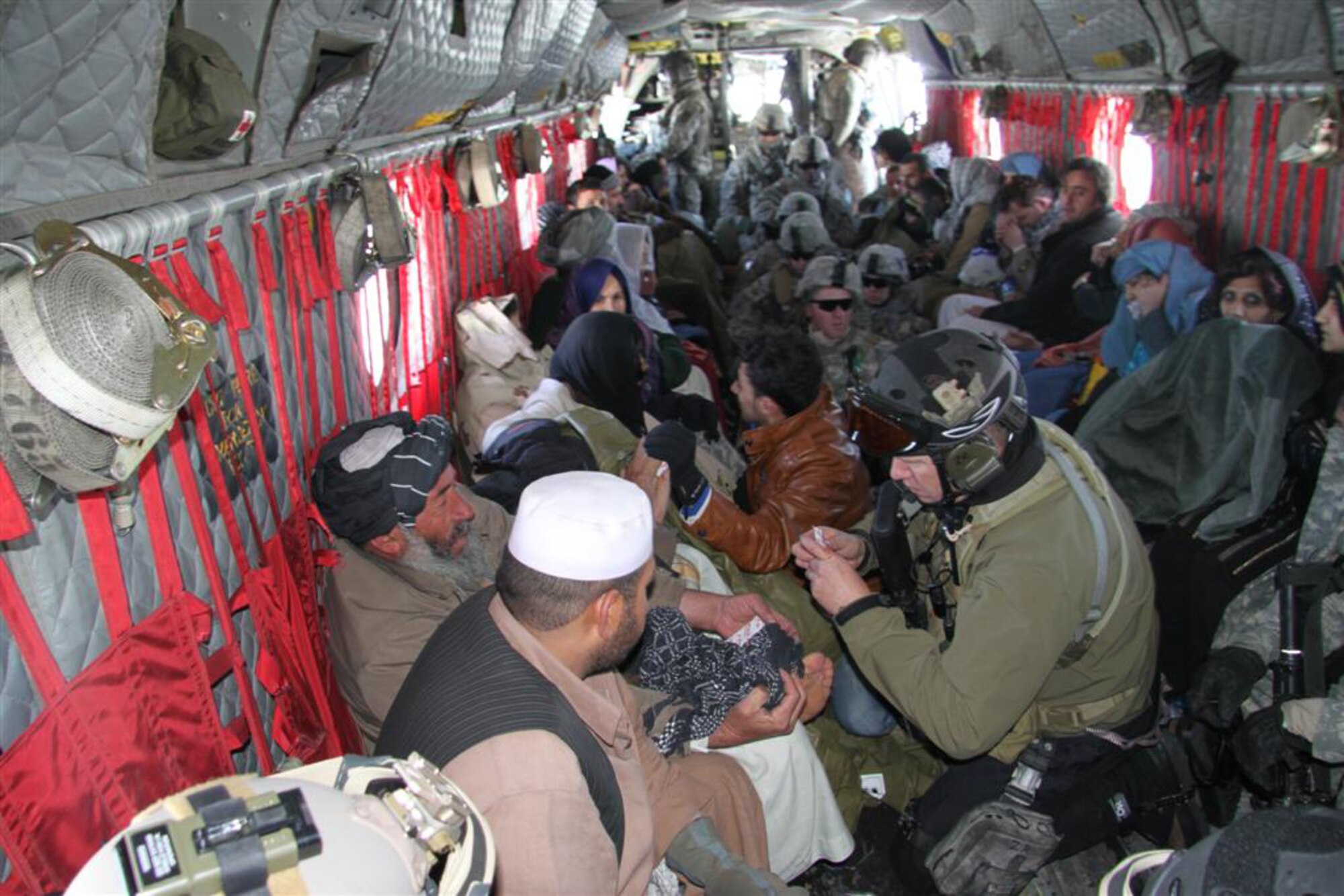 Members of the 33rd Expeditionary Rescue Squadron render medical assistance to survivors of an avalanche, Feb. 9, 2010. The 12-man Guardian Angel team assisted more than 300 Afghans stranded after 36 avalanches fell along the Salang Pass in Afghanistan. (Courtesy Photo)