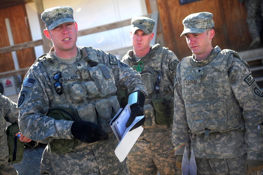 U.S. Army Sgt. William Wallace briefs his platoon before going to ...