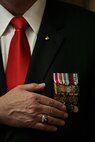 STATEN ISLAND, N.Y. --  A Marine veteran places his hand over his heart as a sign of respect during a ceremony Feb. 19, 2010 at the Marine Corps League Detachment 246 meeting hall in honor of the Marines who fought in the Feb 19 - March 26, 1945 battle of Iwo Jima. (Official Marine Corps photo by Sgt. Randall A. Clinton)