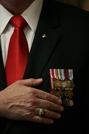 STATEN ISLAND, N.Y. --  A Marine veteran places his hand over his heart as a sign of respect during a ceremony Feb. 19, 2010 at the Marine Corps League Detachment 246 meeting hall in honor of the Marines who fought in the Feb 19 - March 26, 1945 battle of Iwo Jima. (Official Marine Corps photo by Sgt. Randall A. Clinton)