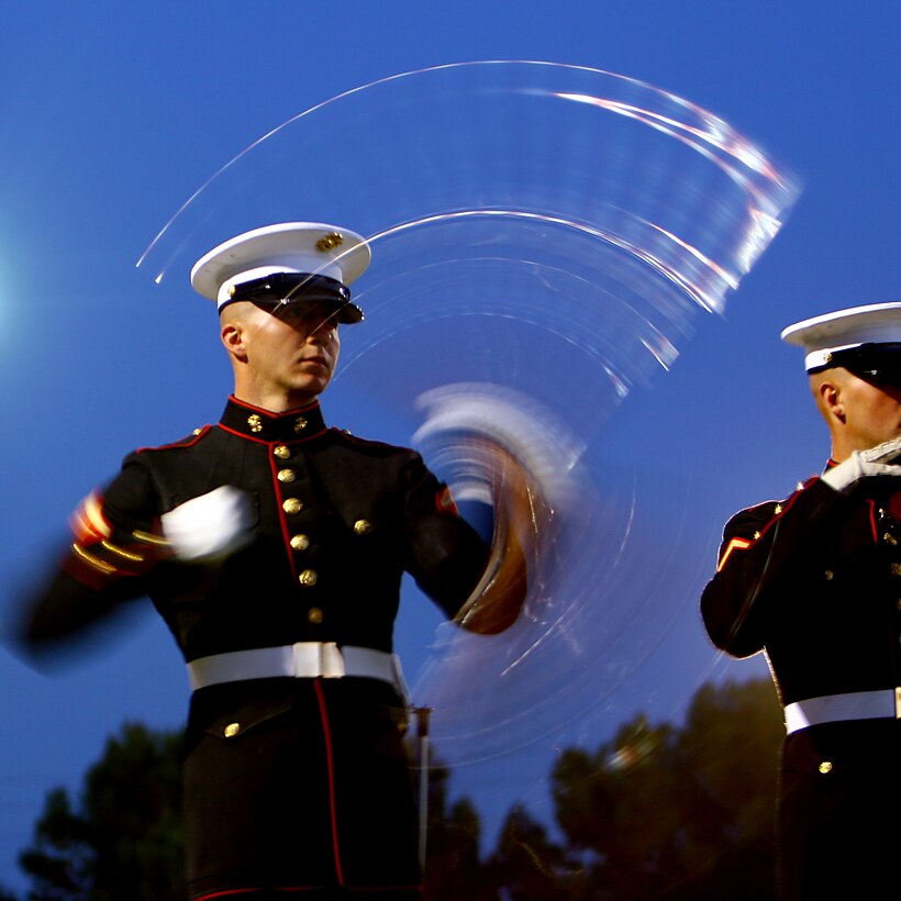 Lance Cpl. Chase Pinkerman, a member of the  United States Marine Silent Drill Platoon, practices his routine into the night at Field 425 Feb. 18. The Silent Drill Platoon is here preparing for the upcoming West Coast Tour with the United States Marine Battle Color Detachment. (Photo by Cpl. Bobby J. Yarbrough)