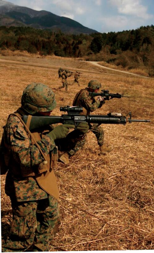 Marines with Combat Engineer Company, Combat Assault Battalion, 3rd Marine Regiment, 3rd Marine Division, III Marine Expeditionary Force, assault through an objective at the Nihonbara Training Area, Japan, Feb. 20 during Forest Light, a bilateral exercise between U.S. forces and Japan Ground Self-Defense Force.