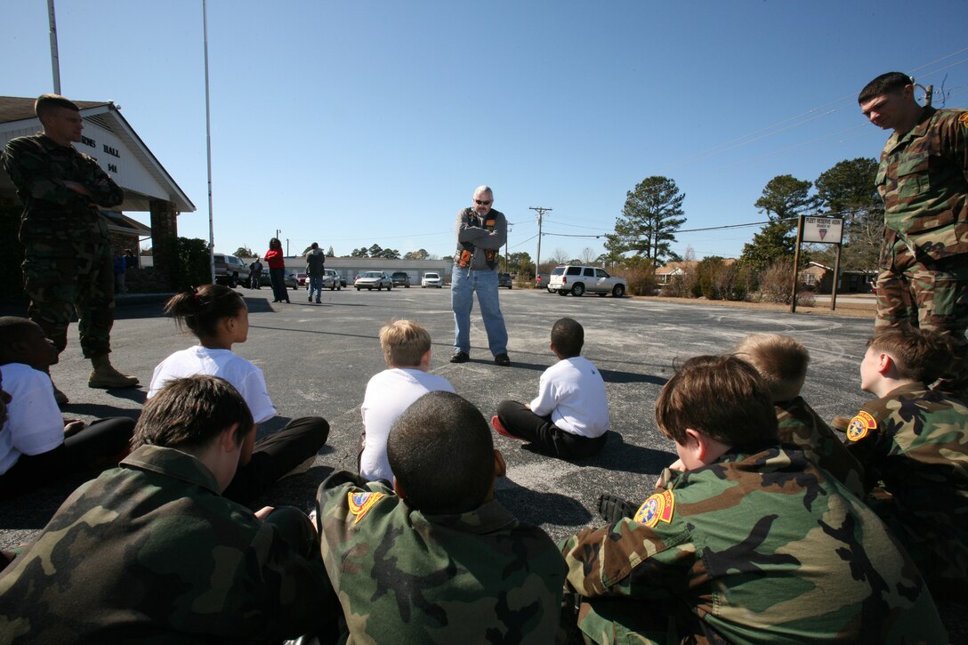 Former Marine Staff Sgt. Bill Sanford, a member of the Ka-Bar chapter of the Leathernecks Motorcycle Club Inc., gives a short history lesson about the club and the Marine Corps to the Havelock Young Marines and recruits at the Fleet Reserve Association’s facility, Branch 141, Feb. 20.
