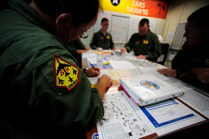 A U.S. Air Force KC-135 Stratotanker crew from the 465 Air Refueling Squadron, Tinker Air Force Base, Okla., conducts a brief before an aerial refueling mission at Andersen AFB, Guam, Feb. 17, 2010. (U.S. Air Force photo by Staff Sgt. Andy M. Kin / Released)