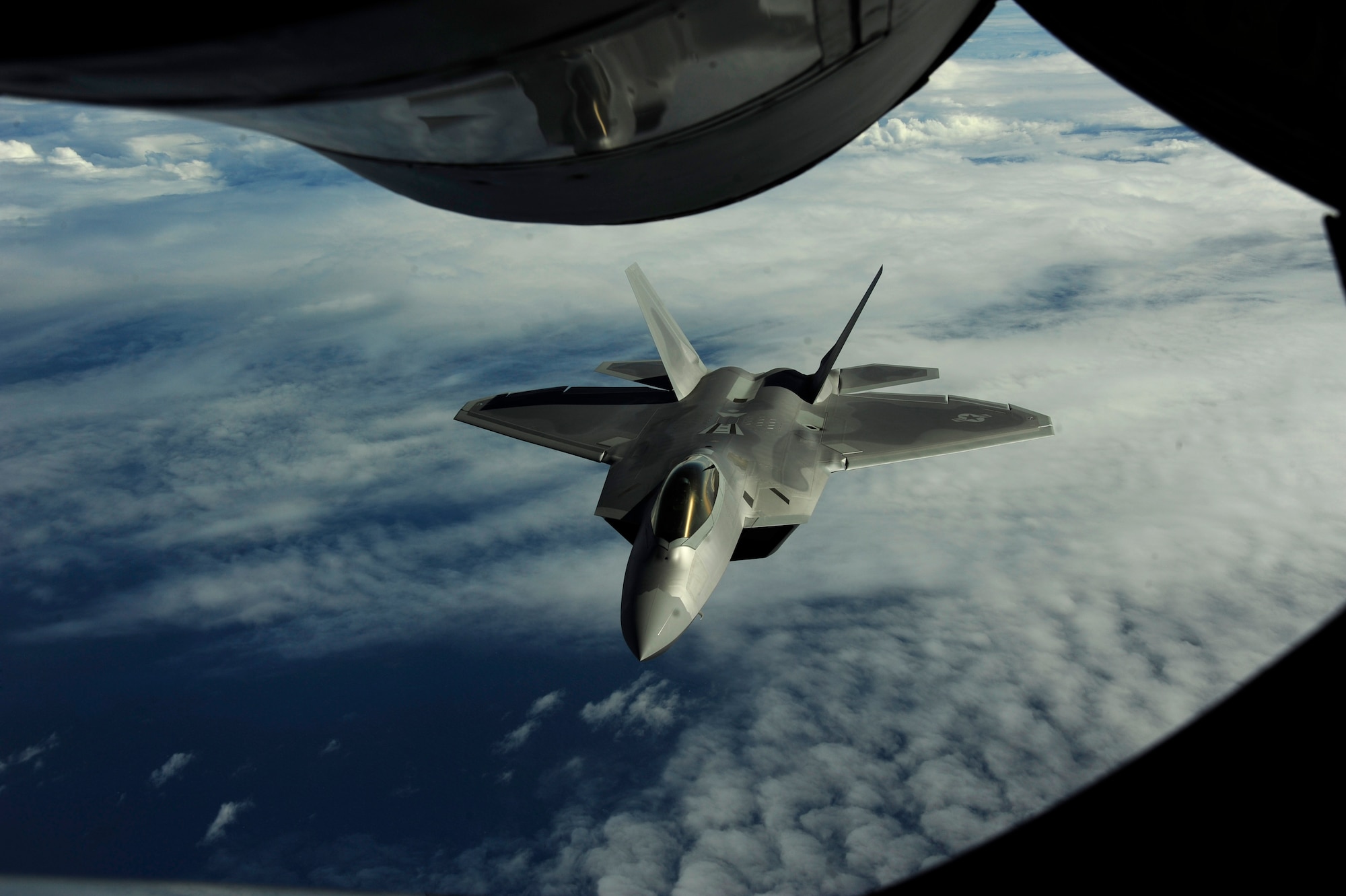A U.S. Air Force F-22 Raptor assigned to the 90th Fighter Squadron, Elmendorf Air Force Base, Alaska, receives fuel from a KC-135 Stratotanker assigned to the 465 Air Refueling Squadron, Tinker AFB, Okla., near Guam, Feb. 17, 2010.
(U.S. Air Force photo by Staff Sgt. Andy M. Kin / Released)