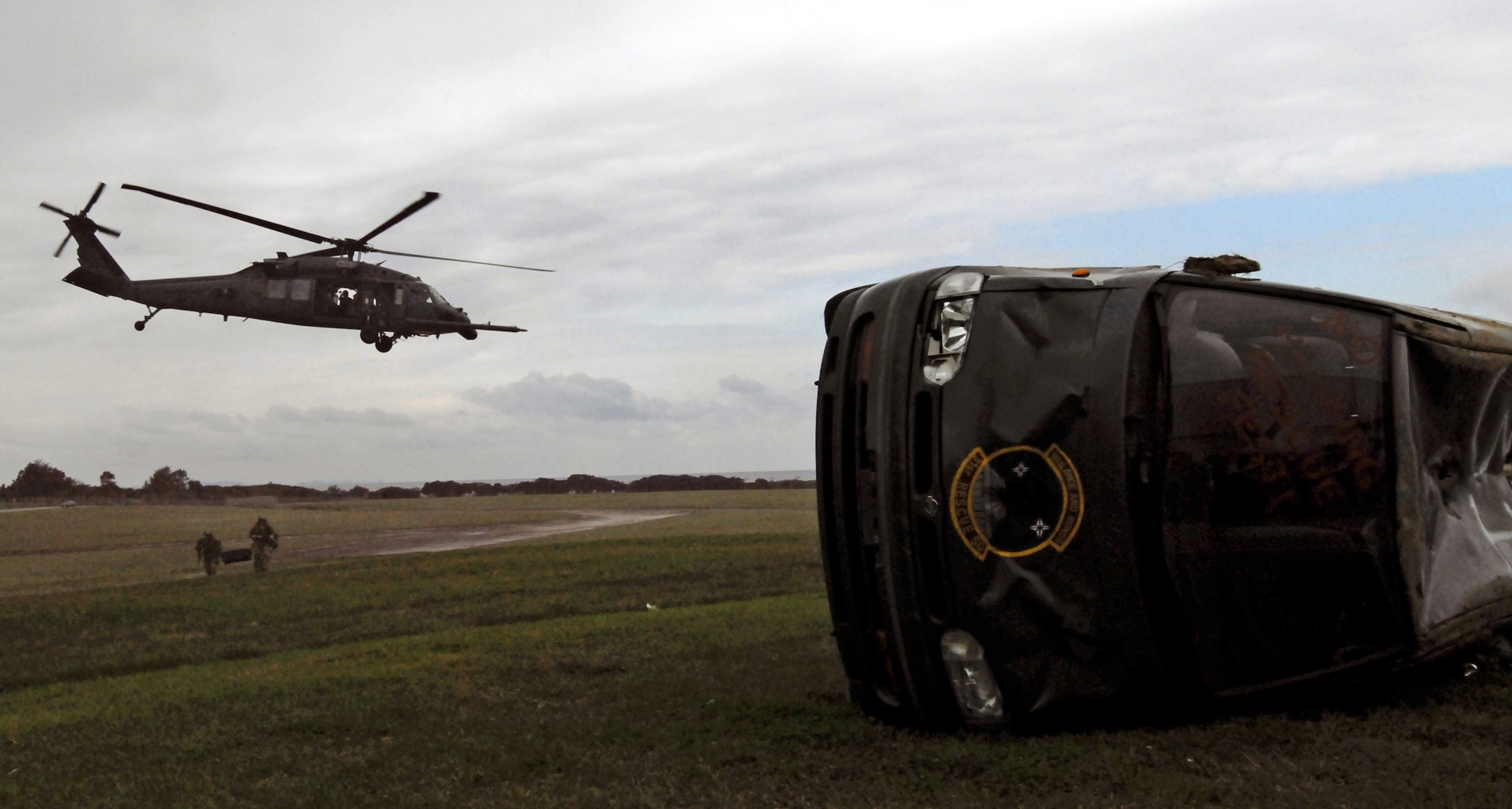 Pararescuemen from the 31st Rescue Squadron make their way toward a simulated vehicle crash during the unit's Rescue Fest Feb. 20. The team fast roped to the site and used the jaws of life to rescue a victim from the vehicle. (U.S. Air Force photo/Staff Sgt. Jason Lake)