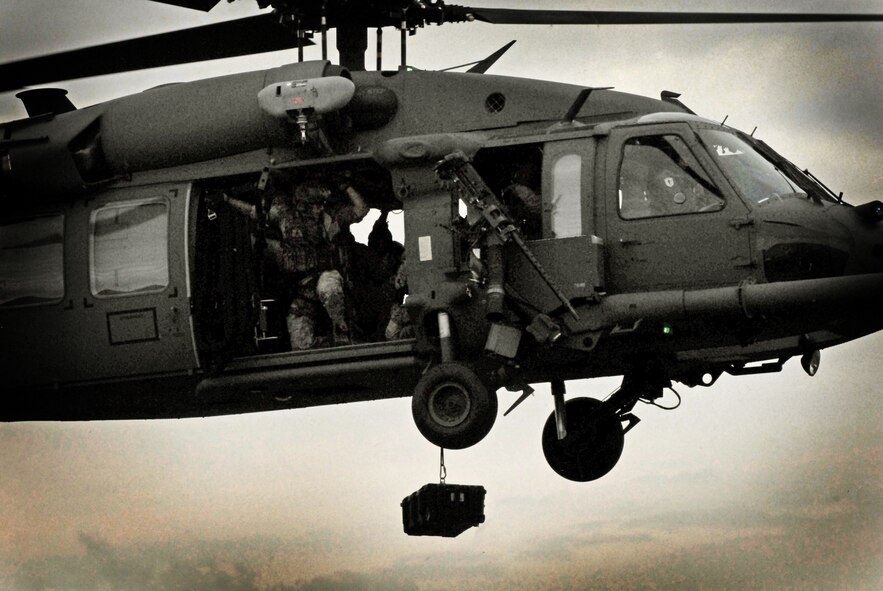 Pararescuemen from the 31st Rescue Squadron lower emergency equipment from an HH-60 Pave Hawk helicopter during the unit's Rescue Fest Feb. 20. The 31st RQS trains, equips and employs combat-ready pararescuemen who are experts in medical care and small-unit tactics providing survivor contact, treatment and extraction during combat rescue operations in hostile or denied territory. The unit uses various fixed- and rotary-wing insertion and extraction assets providing combat and humanitarian search, rescue and medical assistance in all environments. (U.S. Air Force photo/Staff Sgt. Jason Lake)