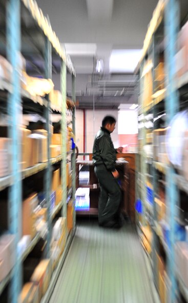 A Japan Air Self Defense Force member learns the process of issuing military supplies from the 18th Logistics Readiness Squadron Feb. 16, 2010. The exchange program, a 5th Air Force initiative established to bolster cultural and professional awareness between the United States Air Force and JASDF, paired seven Japanese military members with a Kadena Airman for one week, allowing them to spend time together both at work and at home. (U.S. Air Force photo/Tech. Sgt. Rey Ramon)  