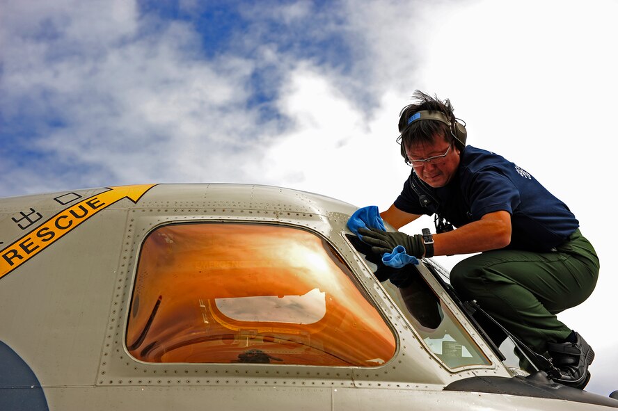 Master Sgt. Yukio Tonozaki, an E-2C Hawkeye aircraft crew chief from 601st Squadron, Airborne Early Warning Group, Misawa Air Base, Japan, cleans an E2-C windscreen during Exercise Cope North at Andersen Air Force Base, Guam,  North, Feb. 18, 2010. The United States Air Force and the Japan Air Self-Defense Force conduct Cope North annually at Andersen Air Force Base to increase combat readiness and interoperability, concentrating on coordination and evaluation of air tactics, techniques and procedures. The ability for both nations to work together increases their preparedness to support real-world contingencies. (U.S. Air Force photo by Staff Sgt. Jacob N. Bailey / Released)