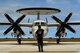 An E-2C Hawkeye aircraft crew chief from 601st Squadron, Airborne Early Warning Group, Misawa Air Base, Japan, directs an E-2C into an aircraft parking spot at Andersen Air Force Base, Guam, during Exercise Cope North, Feb. 18, 2010. The United States Air Force and the Japan Air Self-Defense Force conduct Cope North annually at Andersen Air Force Base to increase combat readiness and interoperability, concentrating on coordination and evaluation of air tactics, techniques and procedures. The ability for both nations to work together increases their preparedness to support real-world contingencies. (U.S. Air Force photo by Staff Sgt. Jacob N. Bailey / Released)
