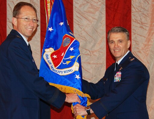Colonel Giordano McMullen (right) accepts the 514th Air Mobility Wing guidon from Maj. Gen James Rubeor, 22nd Air Force commander, during a change-of-command ceremony at Joint Base McGuire-Dix-Lakehurst, NJ, February 21, 2010. Colonel McMullen had served as the wing's vice commander since October 2008. He also has experience as a wing commander, serving as the commander of the 913th Airlift Wing at Willow Grove Air Reserve Station, Penn., from April to October 2007. (U.S. Air Force photo/Staff Sgt. Shawn J. Jones)