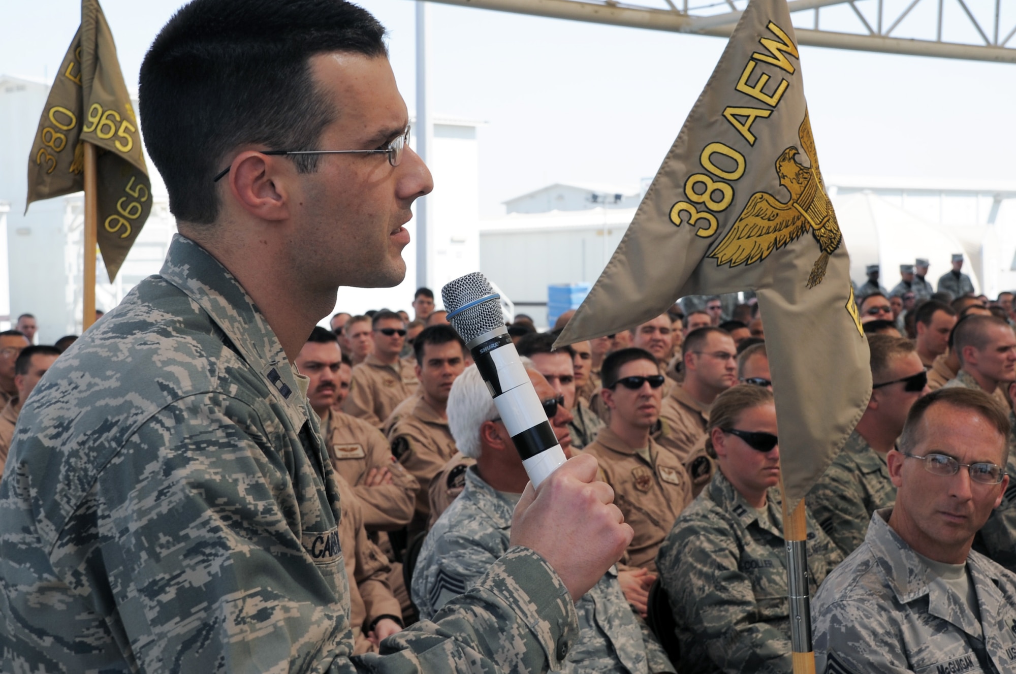 Capt. Jeff Cameron, executive officer to the 380th Air Expeditionary Wing commander, asks a question to U.S. Navy Adm. Mike Mullen, Chairman of the Joint Chiefs of Staff, during a visit to the 380th AEW by Admiral Mullen on Feb. 18, 2010, to a non-disclosed base in Southwest Asia.  (U.S. Air Force Photo/Senior Airman Jenifer Calhoun/Released)