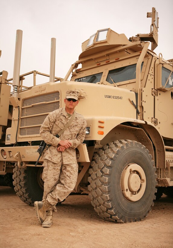 A fit and trim Lance Cpl. Clifton Perkins, a motor transportation operator with Combat Logistics Battalion 6, 1st Marine Logistics Group (Forward), poses next to a “7-Ton” Medium Tactical Vehicle Replacement. Before entering the Marine Corps, Perkins weighed in at 310 pounds and was able to shed more than100 pounds within a six month period prior to enlisting.