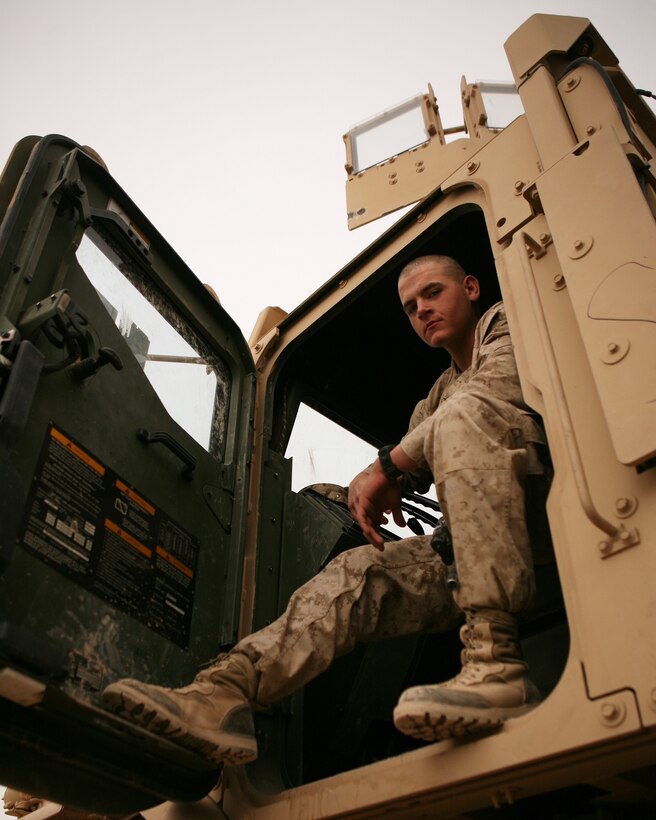 Lance Cpl. Clifton Perkins, a motor transportation operator with Combat Logistics Battalion 6, 1st Marine Logistics Group (Forward) lost 120 pounds in order to earn the title “Marine.” With an intense schedule of running, weight lifting and healthy eating, Perkins was able to accomplish this feat within six months prior to recruit training. Here, he is seen in the cab of a Medium Tactical Vehicle Replacement Feb. 21, 2010.