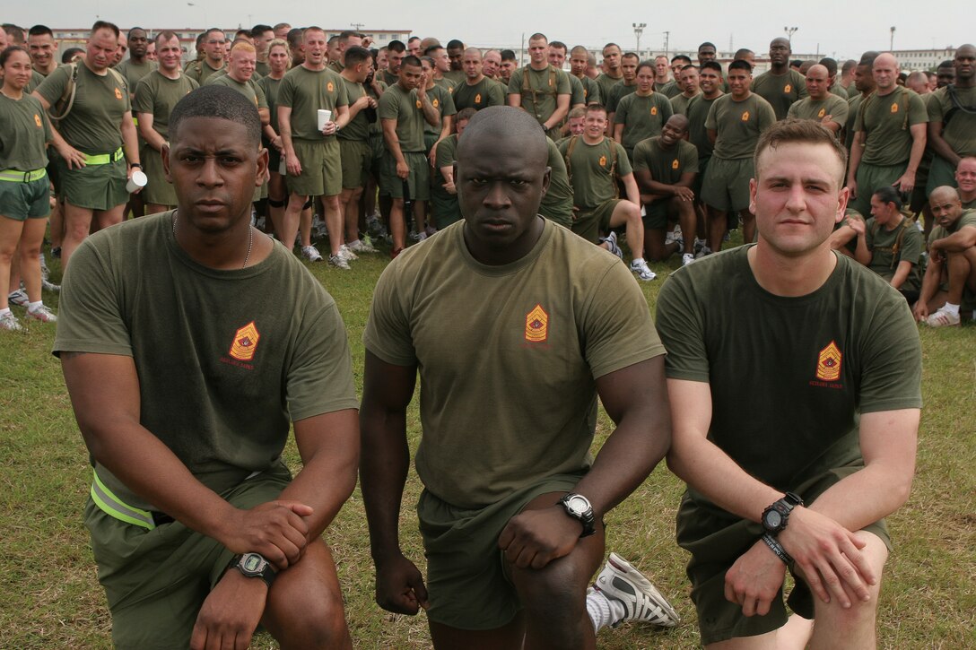 From the left, Gunnery Sgt. Andre Cuthbertson, Staff Sgt. James Jones and Sgt. Kyle Fox were honored as the newest Staff Noncommissioned Officers Academy's Gung-Ho award recipients at the Camp Hansen Theater Wednesday. In the eyes of their peers, Cuthbertson, Jones and Fox proved they truly define what it means to be "Gung-Ho."