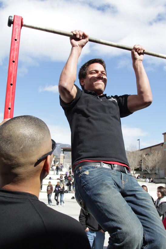 Sean Rojo of Rancho Cucamonga High School participated in a pull-up challenge set up by Marines from the 12th Marine Corps District and Recruiting Station Orange Feb. 22.  Rojo was determined to do 20 pull-ups and earn the top prize awarded at the event.