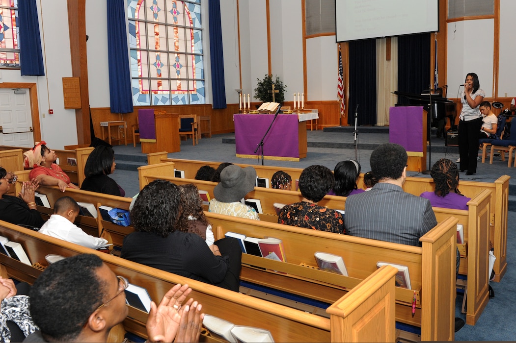 Staff Sgt. LaTanza Meabon-Whiteside, a 19th Logistics Readiness Squadron planner, sings in a Black History Month musical during a gospel worship service held at the base chapel Feb. 21. The musical included singing, dancing and dramatic readings in celebration of Black History Month. (U.S. Air Force photo by Senior Airman Ethan Morgan)