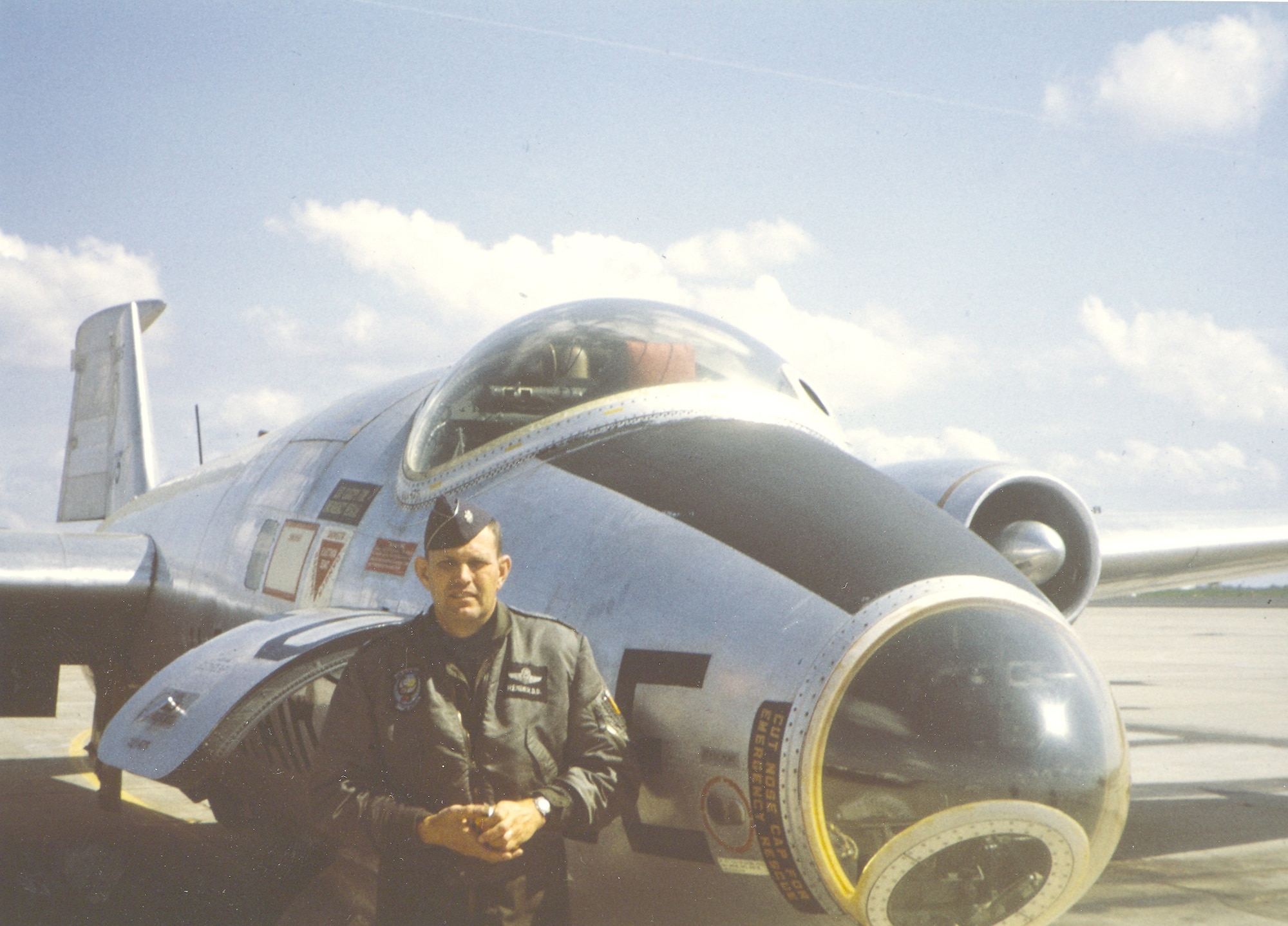Lt. Col. Dave Render stands next to a RB-57 during a cold spring day in May 1972.