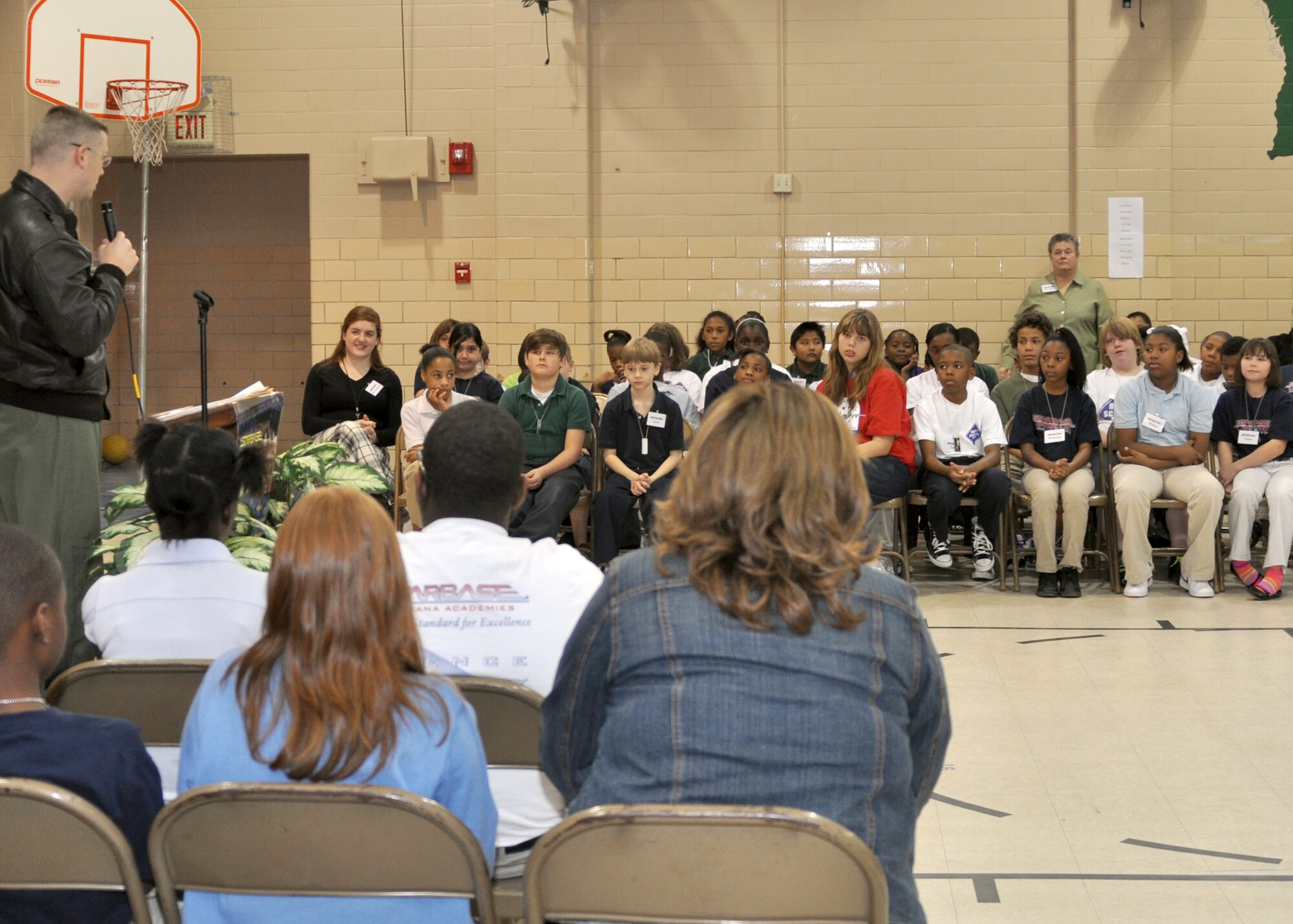 Starbase graduates listen in as Capt. Jonathan Ard, an electronic warfare officer for the 11th Bomb Squadron; currently an instructor for the 93rd Bomb Squadron on Barksdale Air Force Base, La., congratulates them at Meadowview Elementary School in Bossier City, La., on Feb. 8, 2010. Starbase, a Department of Defense funded program, sponsored by the 917th Wing on Barksdale, offers a 25-hour hands-on aerospace and aviation curriculum committed to addressing needs in Science, Technology, Engineering and Mathematics. These students, along with several other classes graduated the course just recently. (U.S. Air Force Photo/Senior Airman Crystal Marie Jordan)