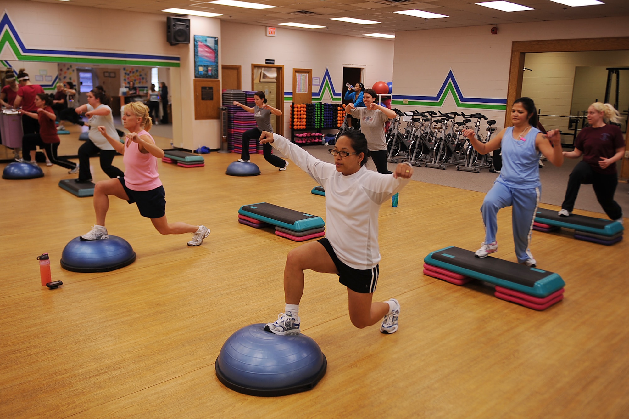 Members of Bellamorphosis women's health club participate in a cardio challenge workout class on Seymour Johnson Air Force Base, N.C., Feb. 22, 2010. Bellamorphosis offers more than 70 classes taught by certified instructors or personal trainers. (U.S. Air Force photo/Senior Airman Ciara Wymbs) 