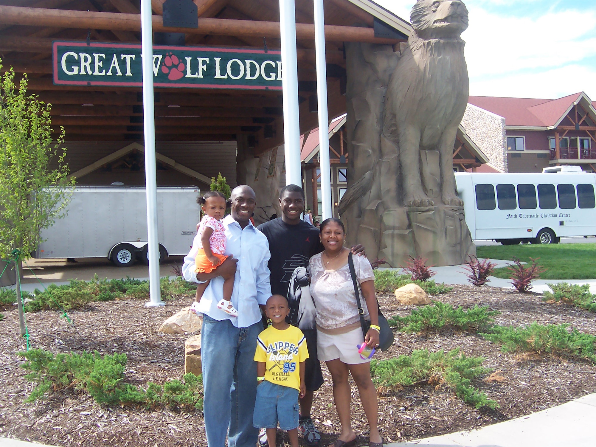 Master Sgt. Shaffinie Wallace, 4th Medical Group first sergeant, Master Sgt. Ataya Wallace, 4th Fighter Wing command section superintendent, and their children Kyra, 2, Aaron, 5, and Tearris, 15, vacation at Great Wolf Lodge, Charlotte-Concord, N.C., July 2009. The husband and wife team reenlisted together in the Thomas Koritz Clinic training room on Seymour Johnson Air Force Base, N.C., Feb. 19, 2010. Ataya hails from Madisonville, Ky, and Shaffinie is from Butler, Ala.(Courtesy photo) 
