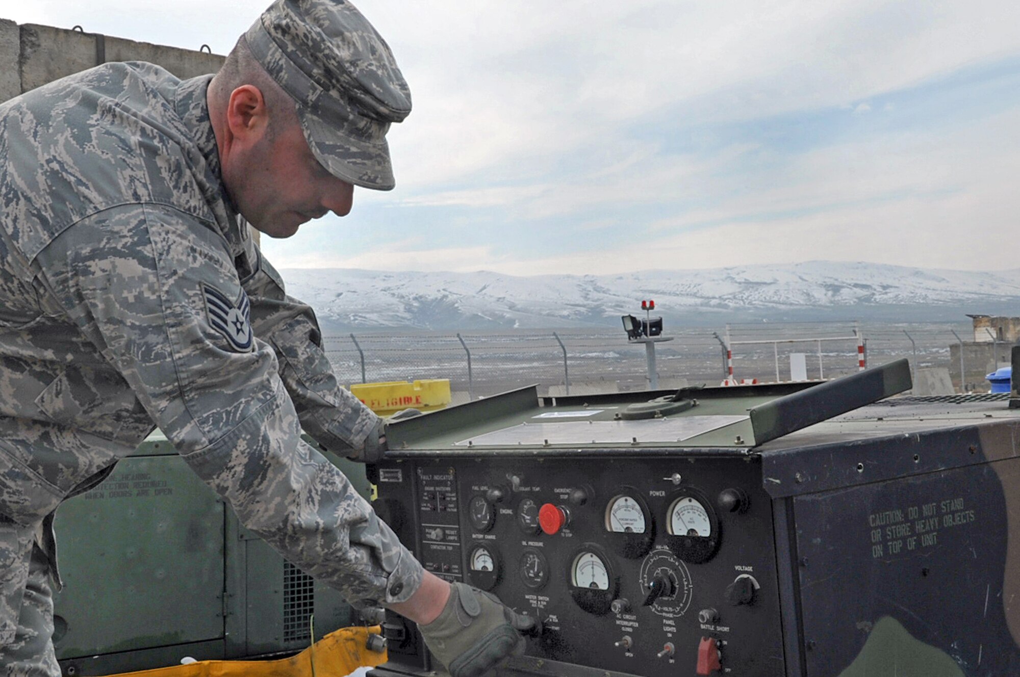Staff Sgt. James Morgan starts up a mobile electric power generator used to power equipment Feb. 9, 2010, at the Krtsanisi National Training Center, Republic of Georgia. Sergeant Morgan is an electrical power production technician assigned to the 1st Combat Communications Squadron. (U.S. Air Force photo/Senior Airman Tony R. Ritter) 