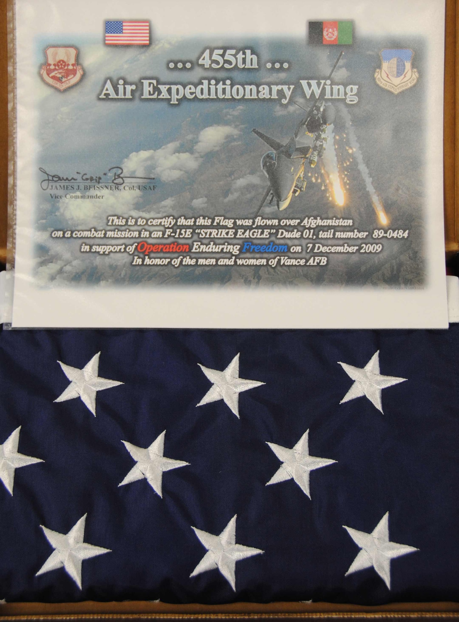 This flag will fly atop the Vance AFB flagpole Friday, Feb. 26. It was carried onboard an F-15E Strike Eagle during a ground forces support mission Dec. 7, 2009. The flag is accompanied by a certificate commemorating its flight. (U.S. Air Force photo/Ensign Rex Miller)