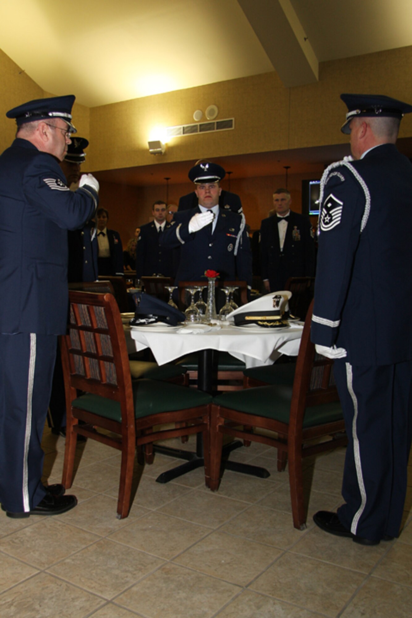 GRISSOM AIR RESERVE BASE, Ind., -- Members of the Grissom Honor Guard begin to render salutes during a special POW/MIA ceremony.  The ceremony is a stark reminder of those brave men and women from all branches of the military who sacrificied for their nation.  (U.S. Air Force photo/Tech. Sgt. Mark Orders-Woepmner)
