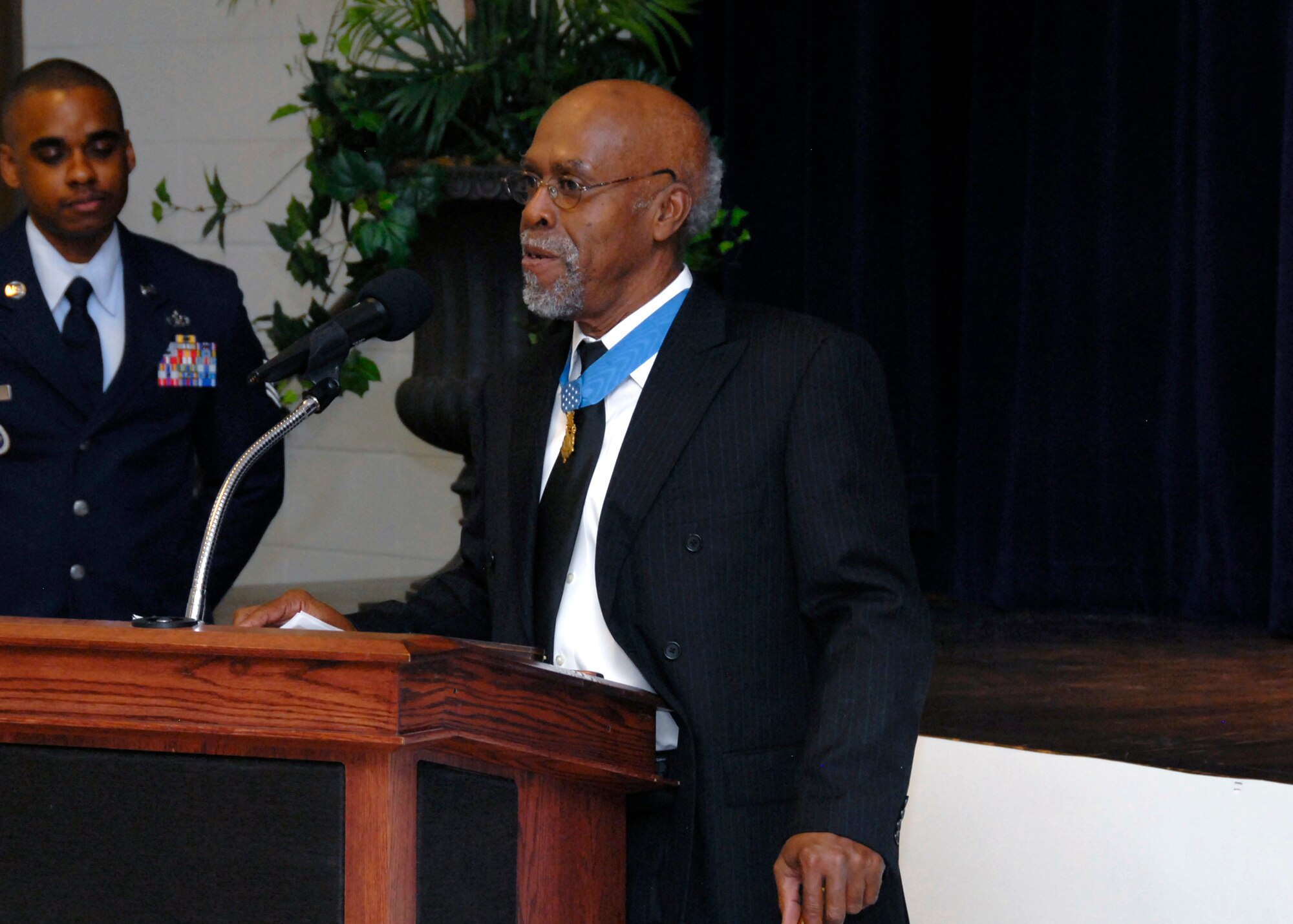 Clarence Sasser, Medal of Honor recipient, speaks at the Living Legends Banquet Museum at the Community Center Feb. 19. (U.S. Air Force photo/Mike Litteken)